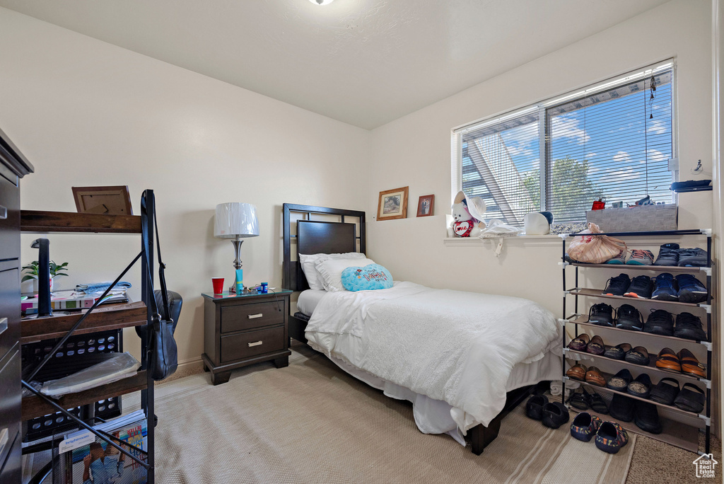 Bedroom with light colored carpet