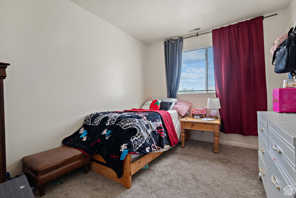 Bedroom with carpet flooring