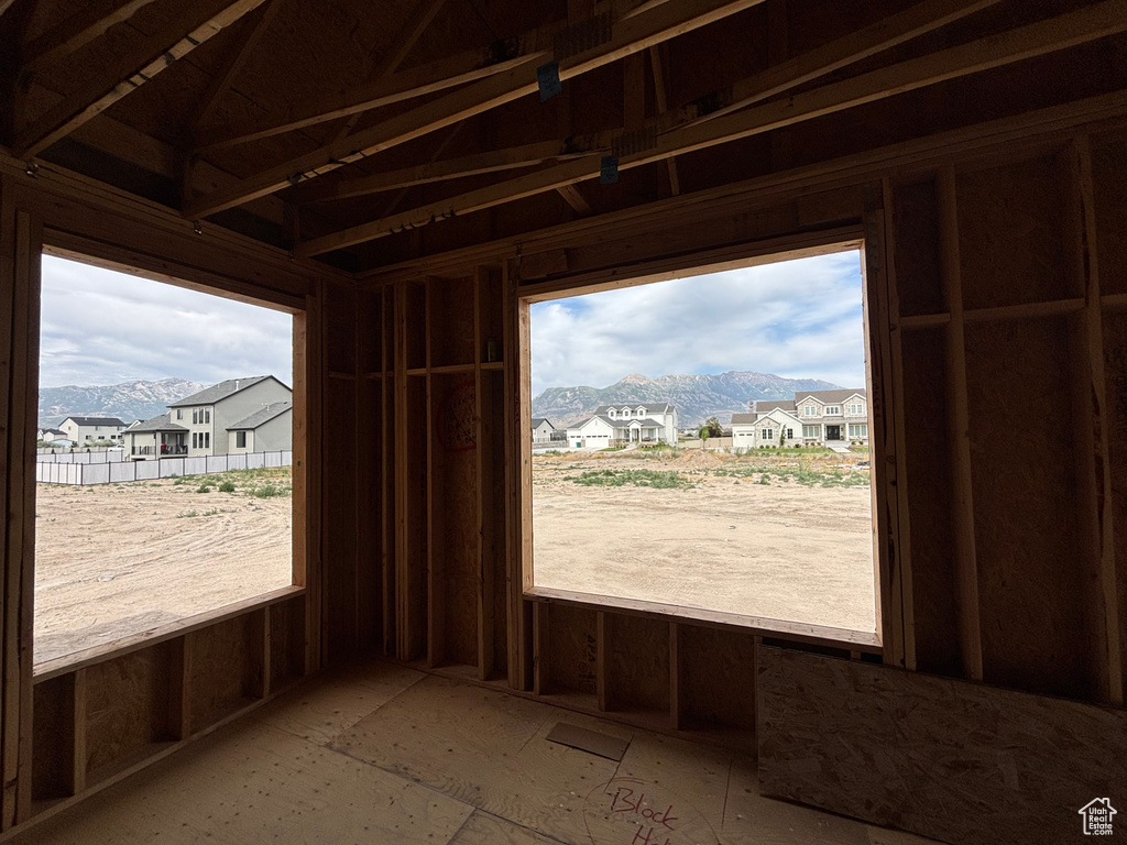 Misc room with a mountain view, a residential view, and plenty of natural light