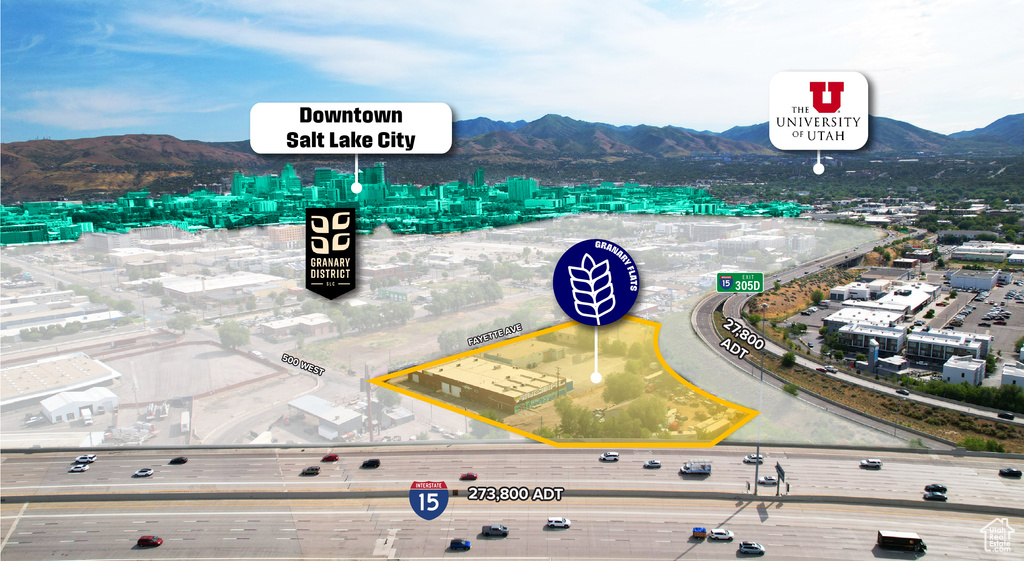 View of urban area with a mountainous background and property parcel outlined