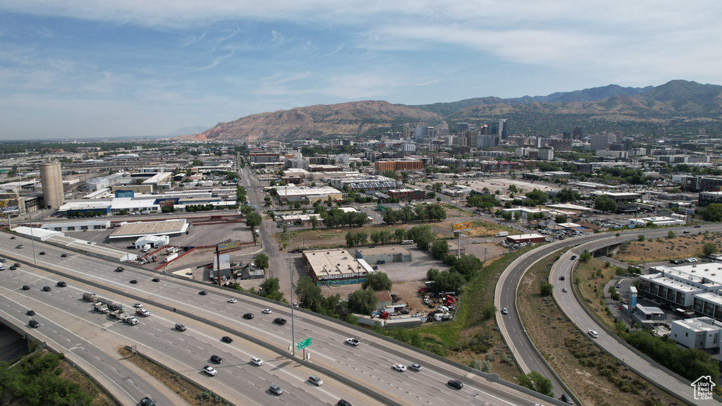 Aerial view of property's location featuring a main thoroughfare and a mountainous background