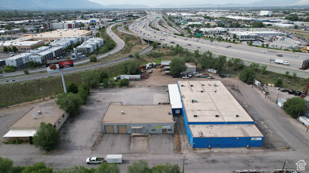 Aerial view of a mountain backdrop and a major roadway