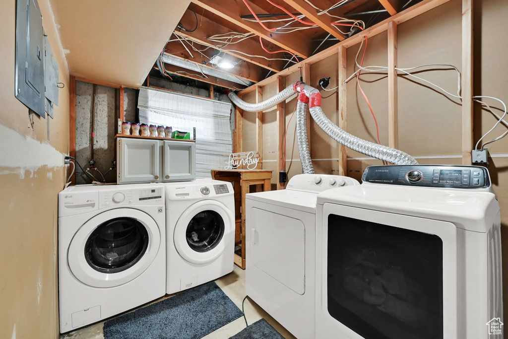 Washroom with washing machine and dryer and electric panel