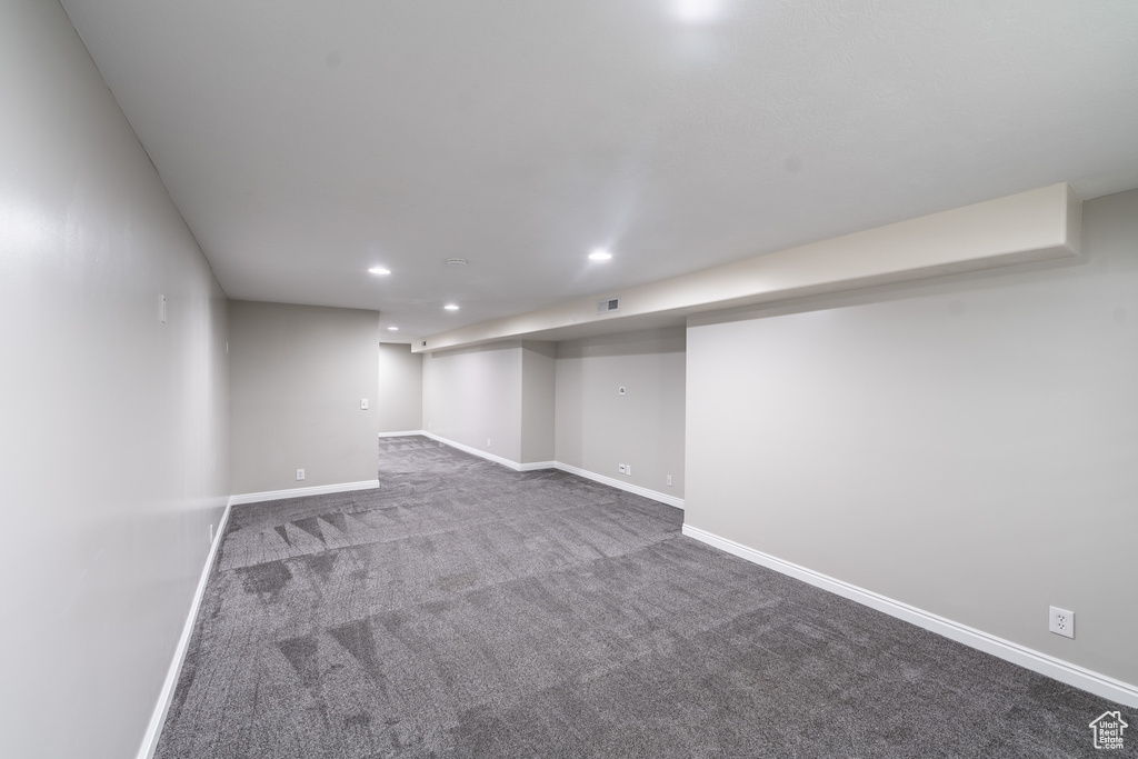 Finished basement with carpet and recessed lighting