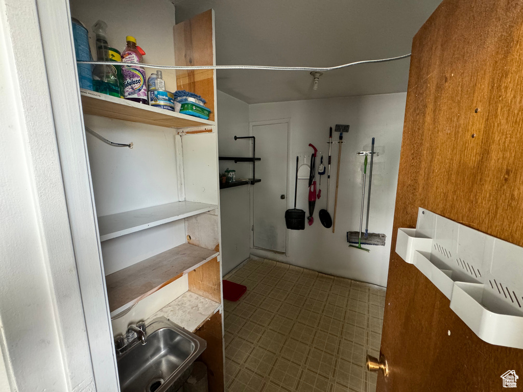 Bathroom with a sink and tile patterned flooring