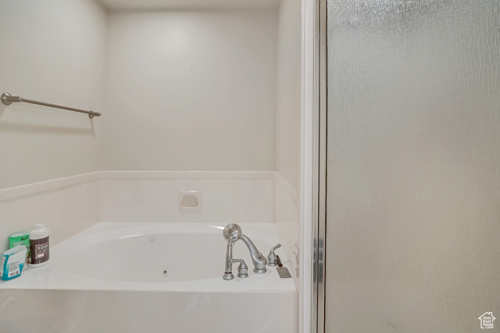 Full bath with a garden tub and a shower stall