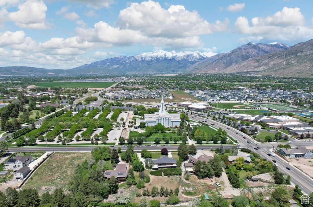 Aerial perspective of suburban area with a mountain backdrop