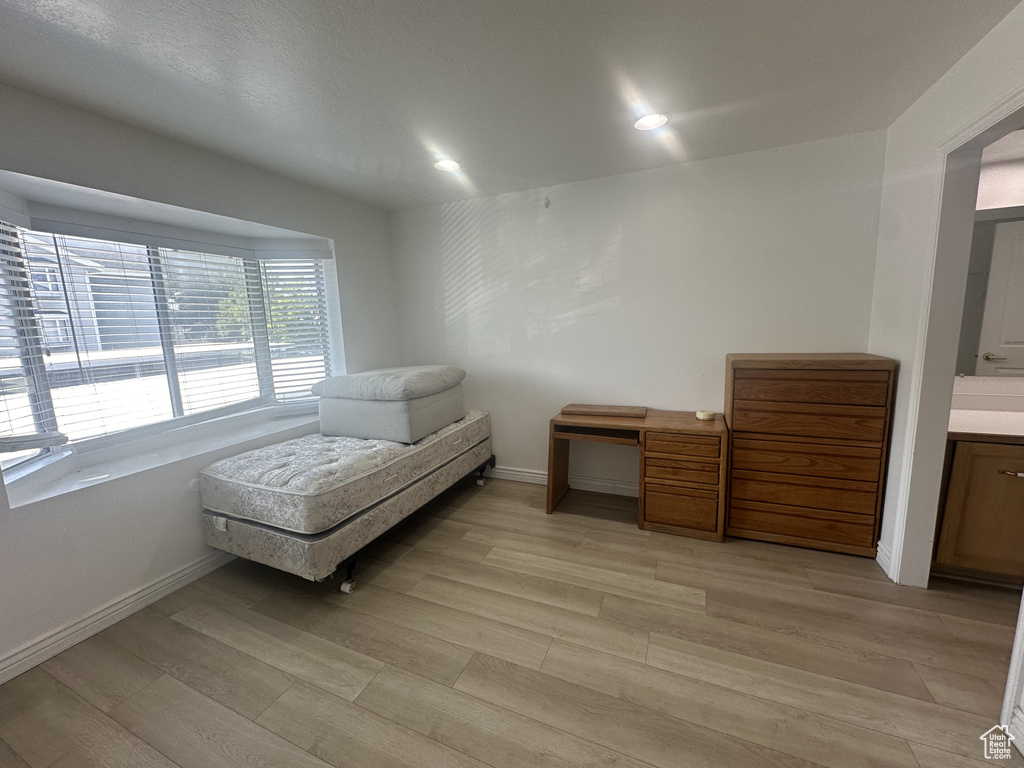 Sitting room featuring light wood-style floors and recessed lighting