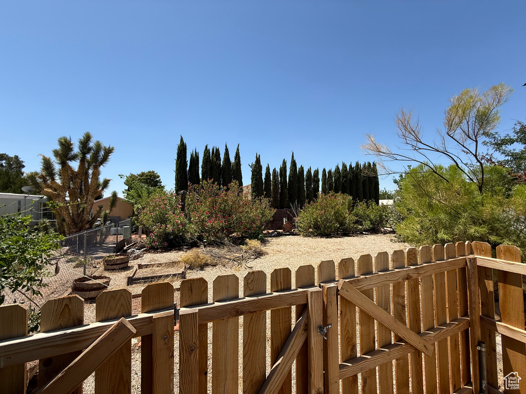 View of yard with a gate