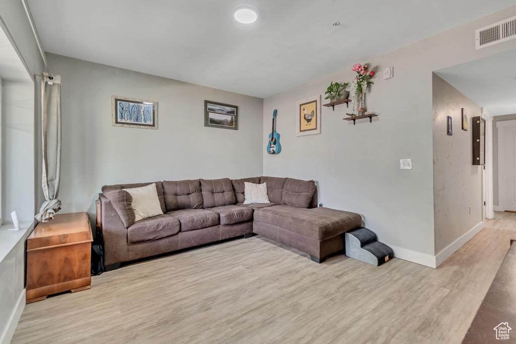 Living area featuring wood finished floors and baseboards