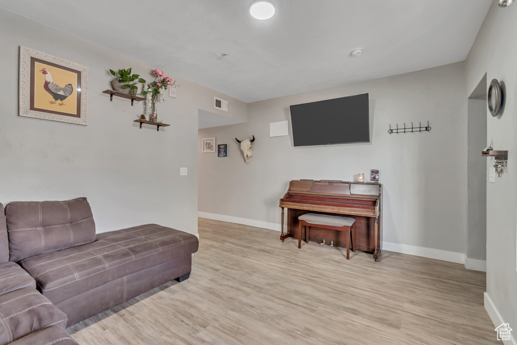 Living room with light wood-style floors