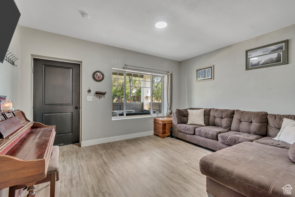 Living room featuring light wood finished floors and baseboards