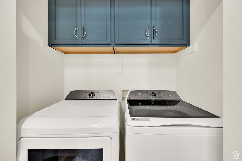 Laundry room with cabinet space and independent washer and dryer