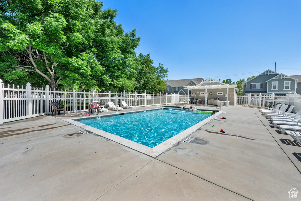 Community pool with a patio