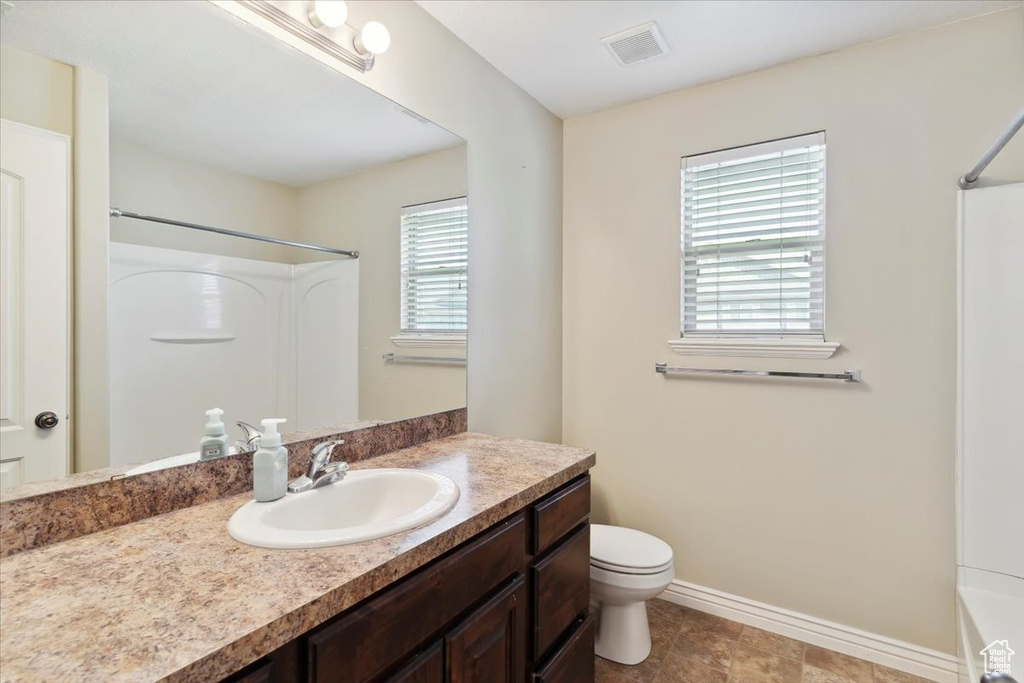 Bathroom with vanity and toilet