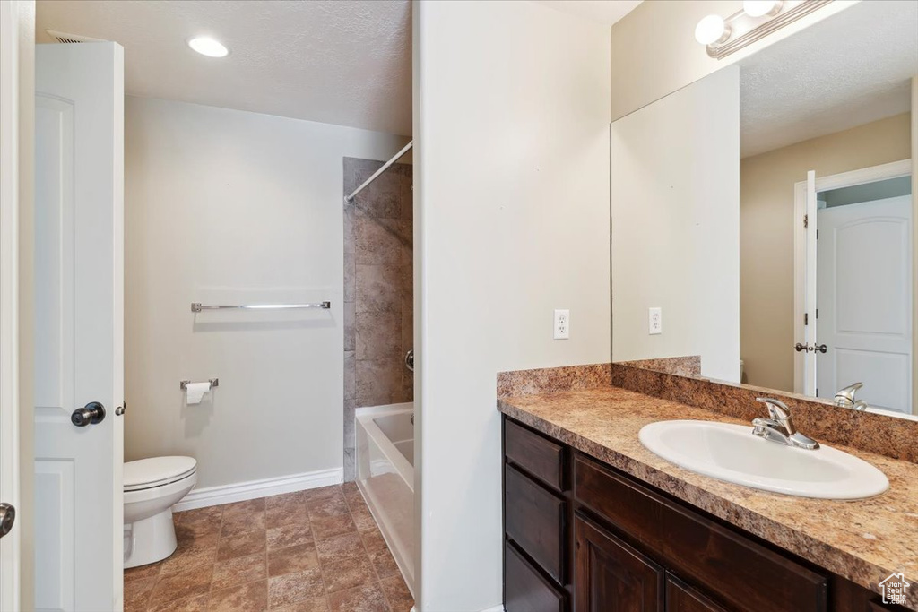 Full bath featuring vanity and bathing tub / shower combination
