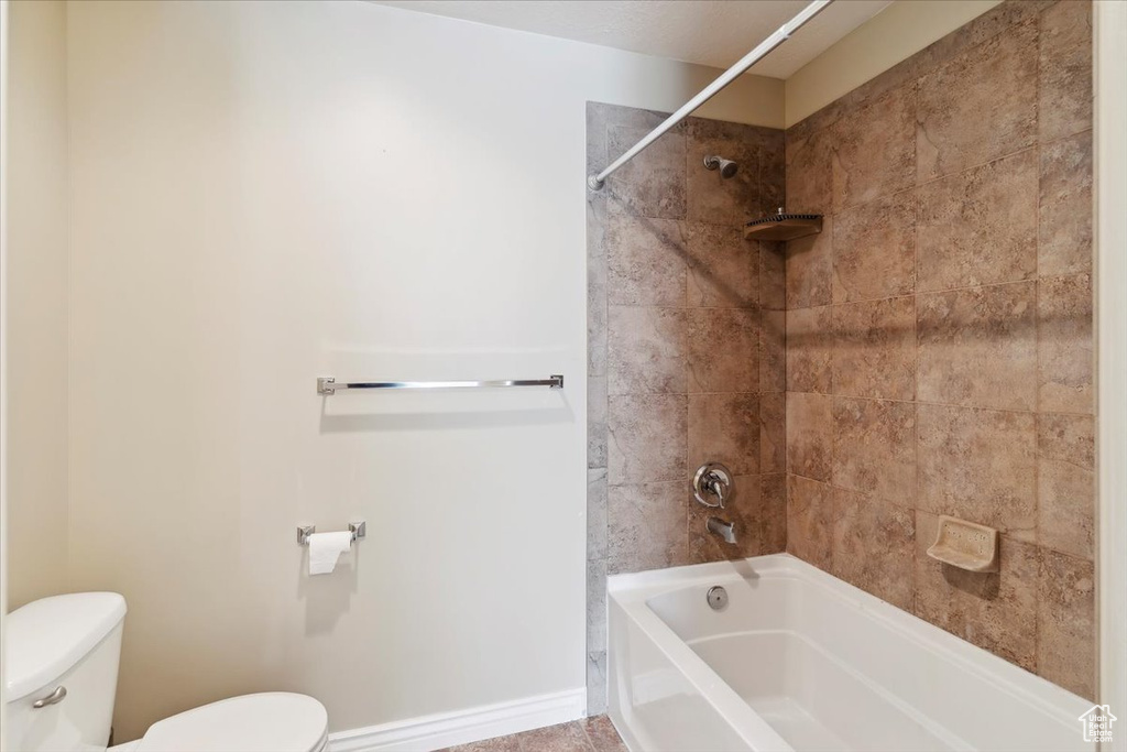 Full bathroom featuring toilet and bathtub / shower combination