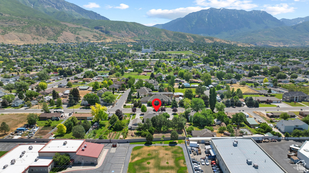 Aerial perspective of suburban area with a mountain backdrop