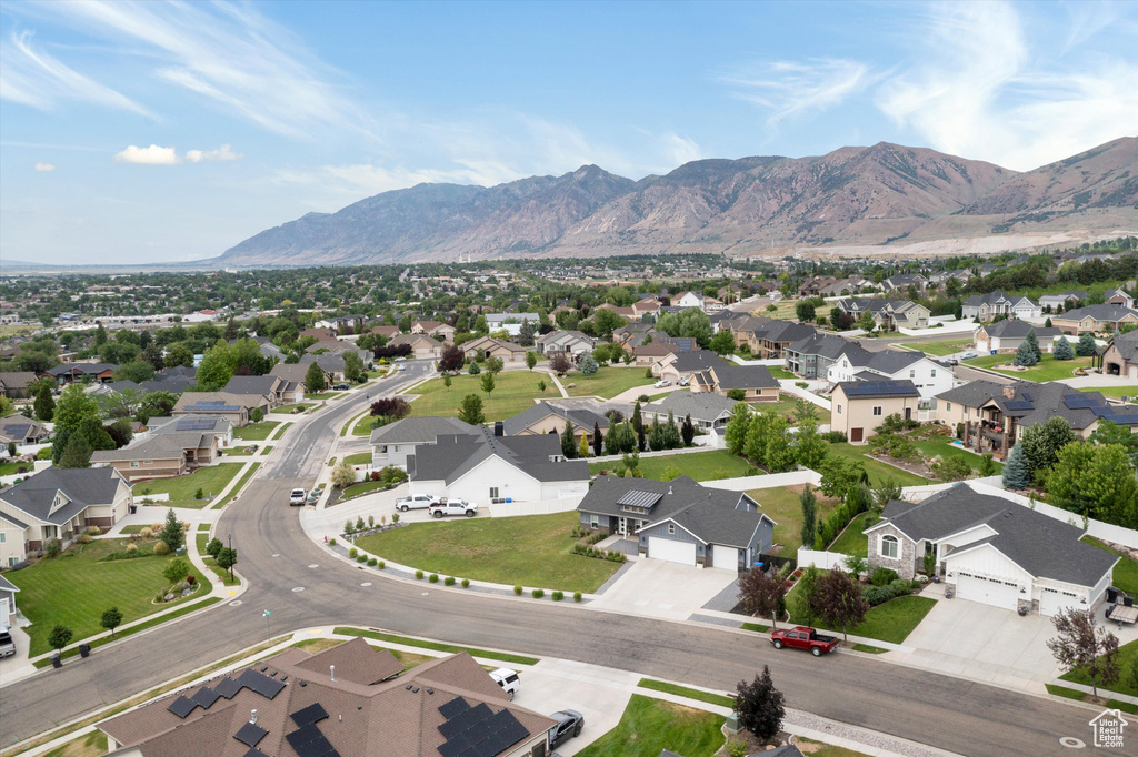Aerial view of residential area featuring a mountain backdrop