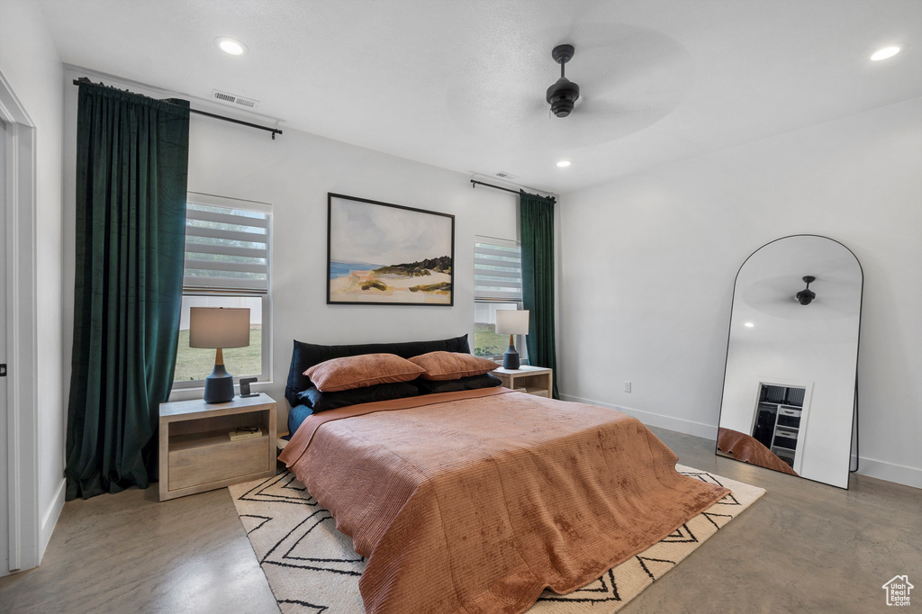 Bedroom featuring recessed lighting, concrete flooring, and a ceiling fan