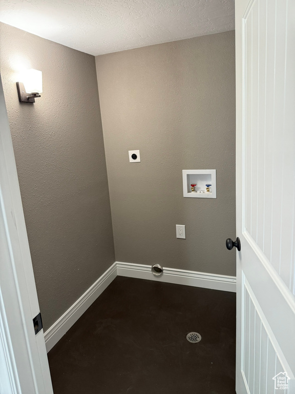 Laundry room featuring electric dryer hookup and washer hookup