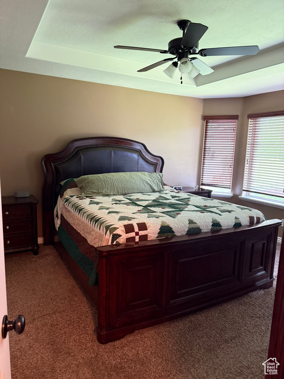 Bedroom featuring carpet flooring and a ceiling fan
