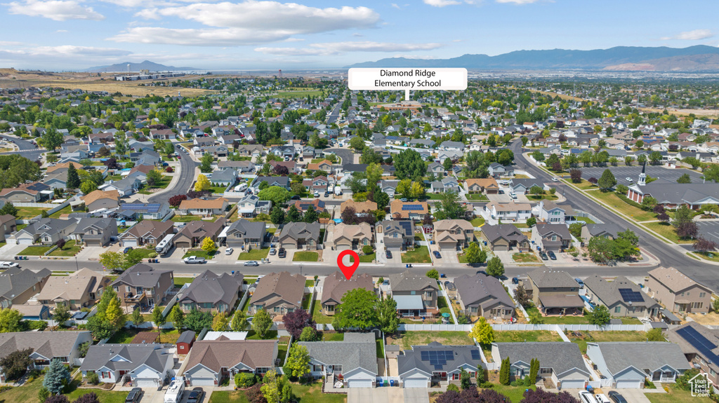 View of property location featuring a mountain backdrop and nearby suburban area