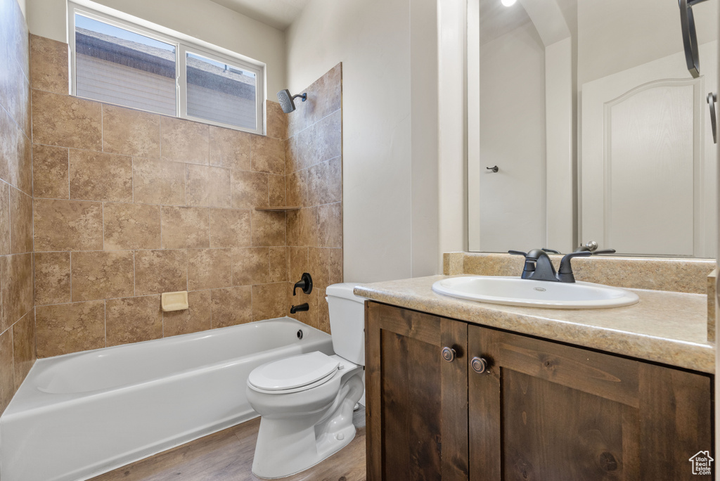 Bathroom with shower / tub combination and vanity