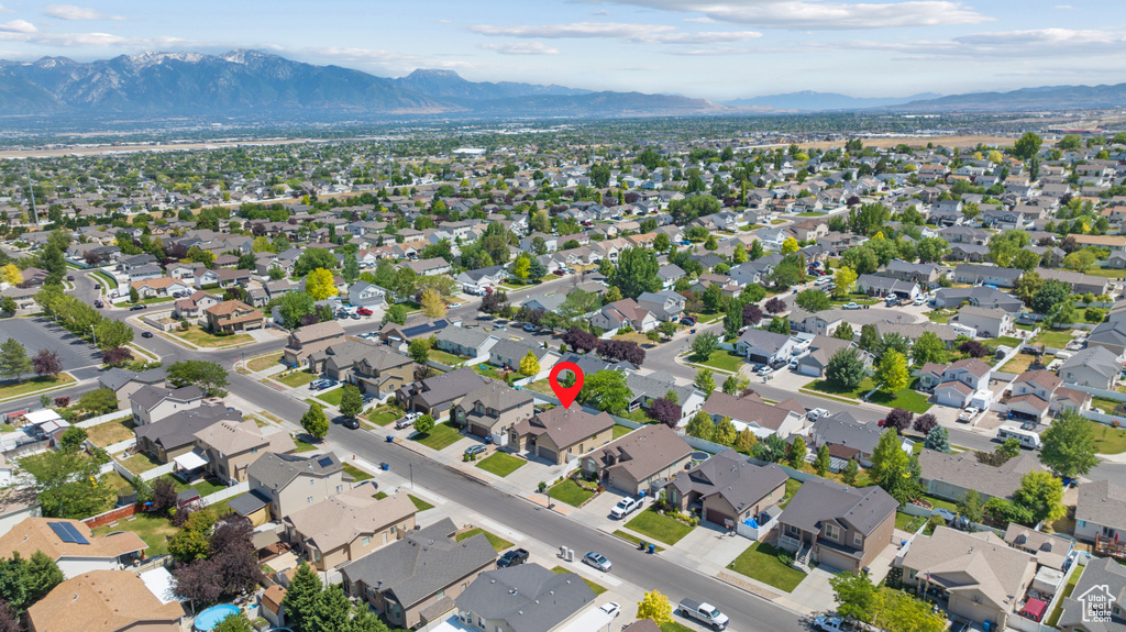 View of property location featuring a mountain backdrop and nearby suburban area