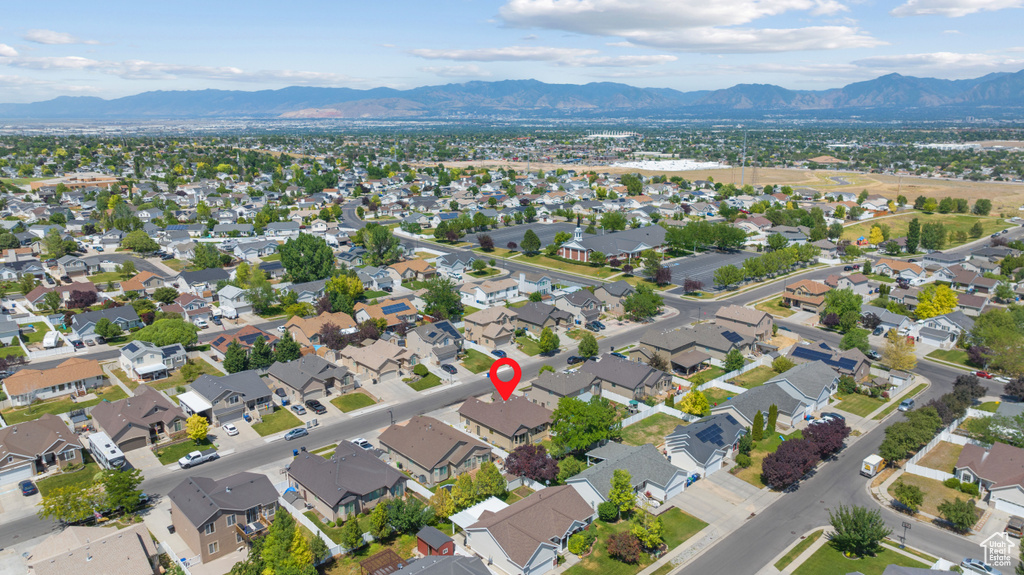 View of property location with a mountainous background and nearby suburban area