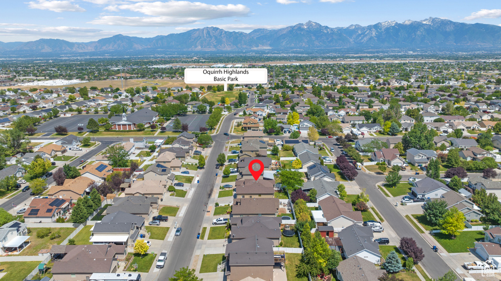 Aerial perspective of suburban area with a mountainous background