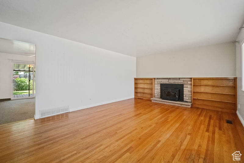 Unfurnished living room with wood finished floors