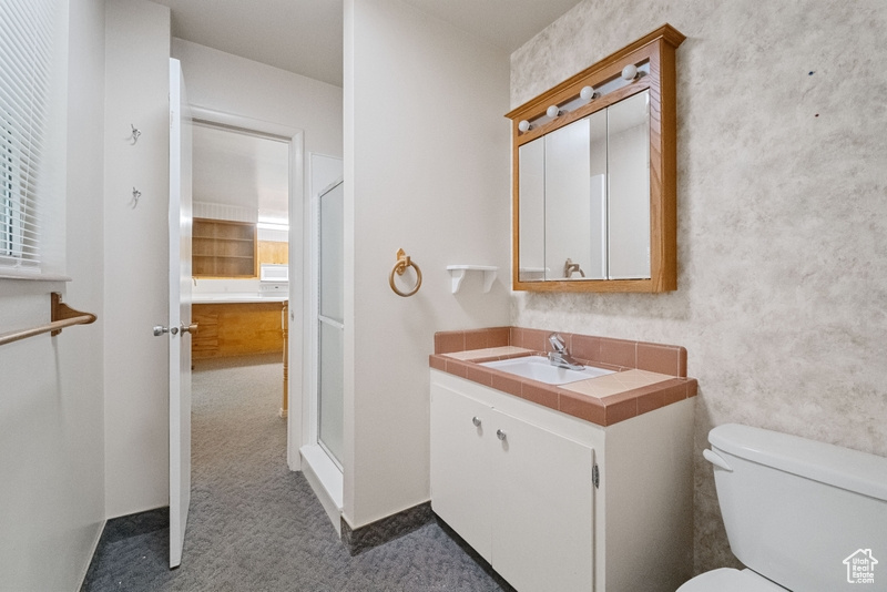 Bathroom with vanity and toilet