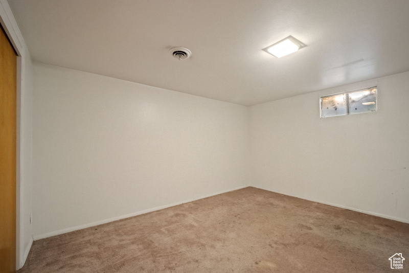 View of carpeted spare room