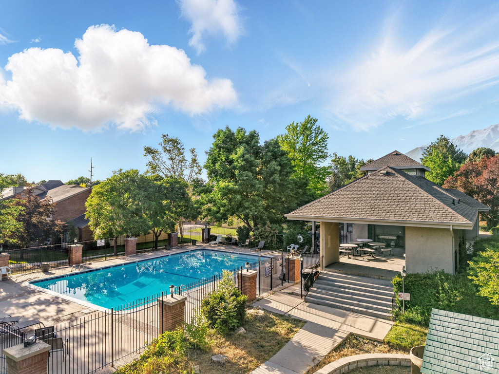 Community pool featuring a gazebo and a patio area