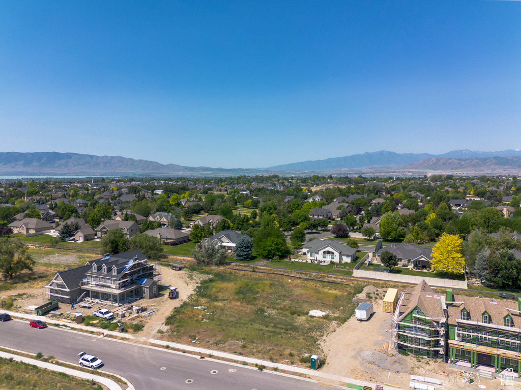 Aerial perspective of suburban area featuring a mountainous background