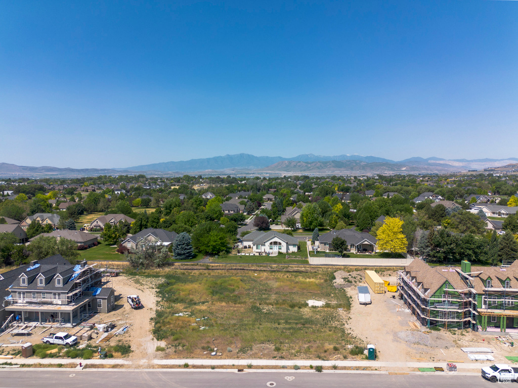 Aerial view of residential area featuring a mountain backdrop