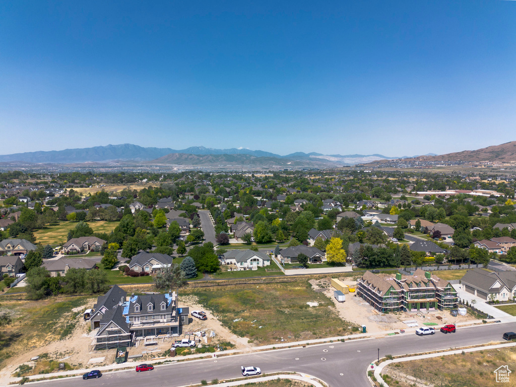 Aerial perspective of suburban area featuring a mountain backdrop