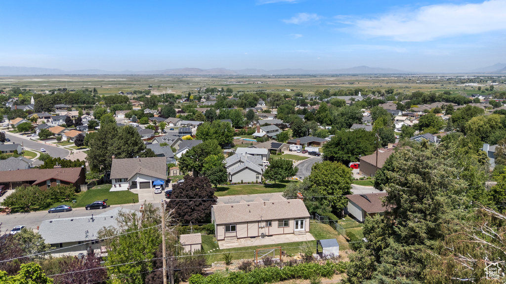 Aerial view of residential area with a mountainous background