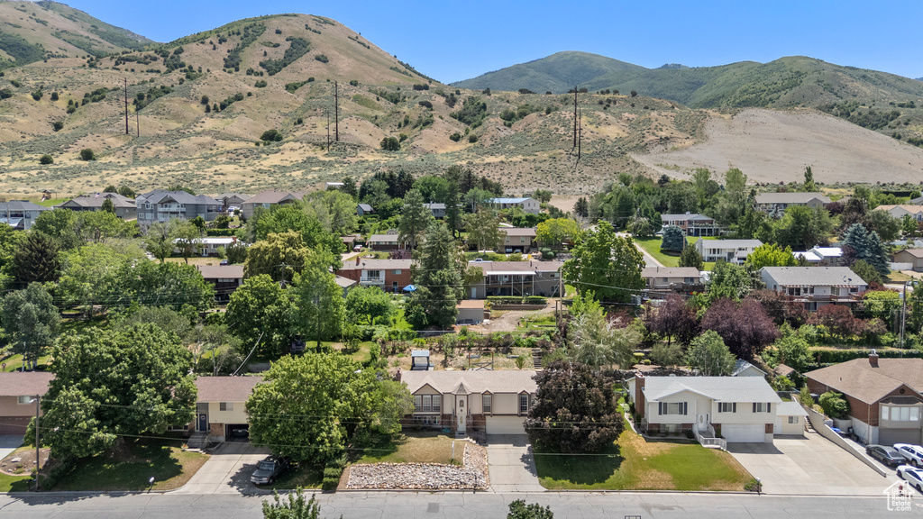 View of mountain backdrop featuring nearby suburban area