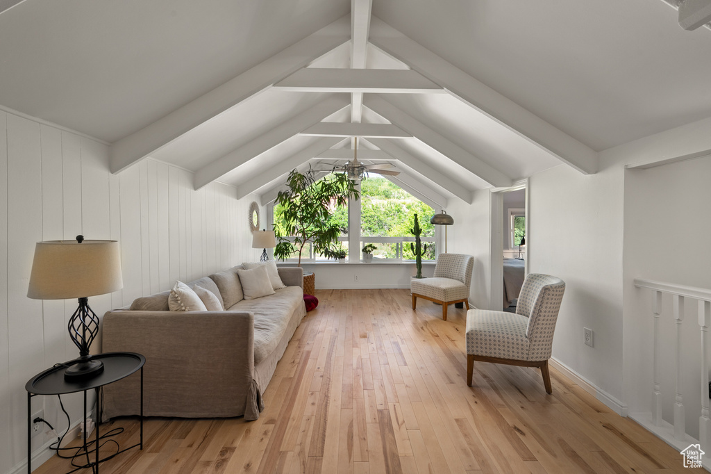 Living area featuring light wood finished floors and ceiling fan