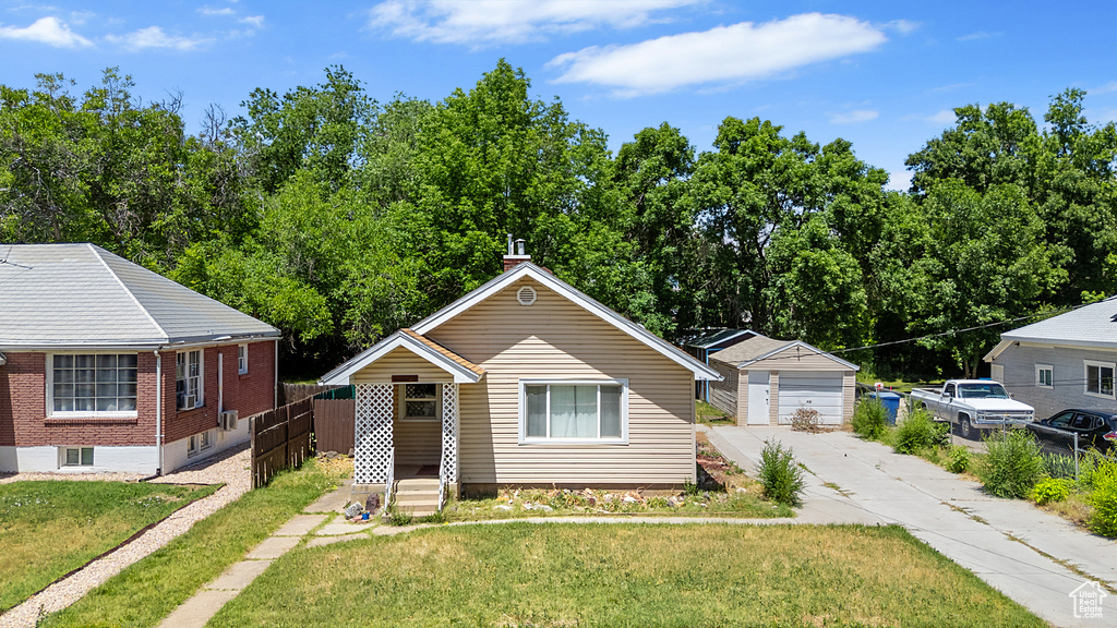 View of front of property with brick siding and a garage