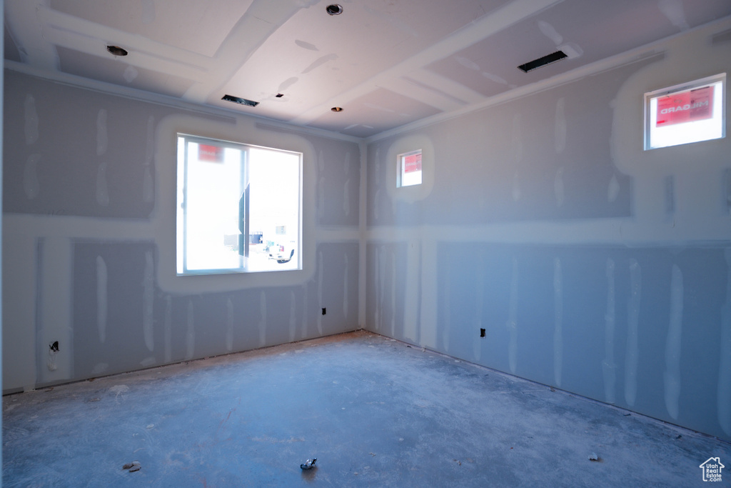 Spare room with healthy amount of natural light