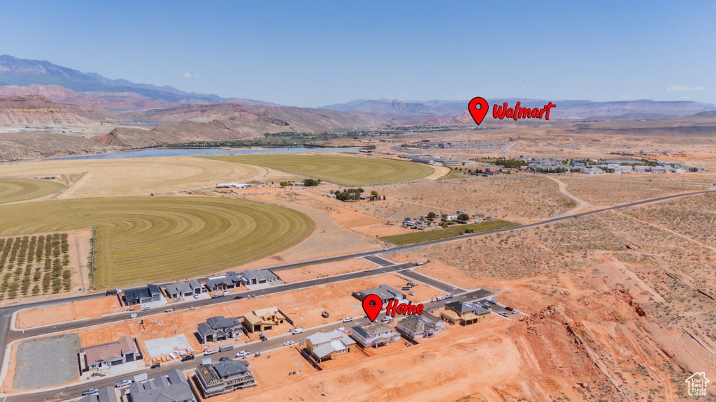 Aerial overview of property's location featuring a water and mountain view