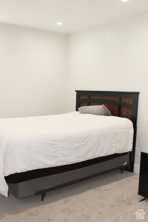 Bedroom with carpet floors and recessed lighting