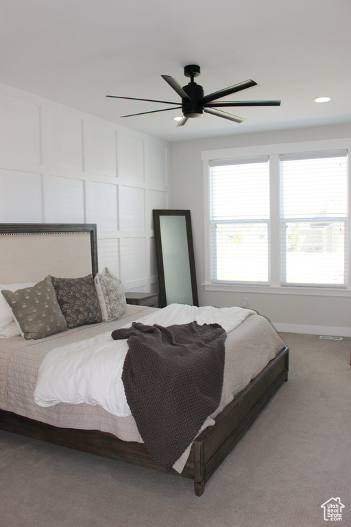 Bedroom with carpet flooring and ceiling fan