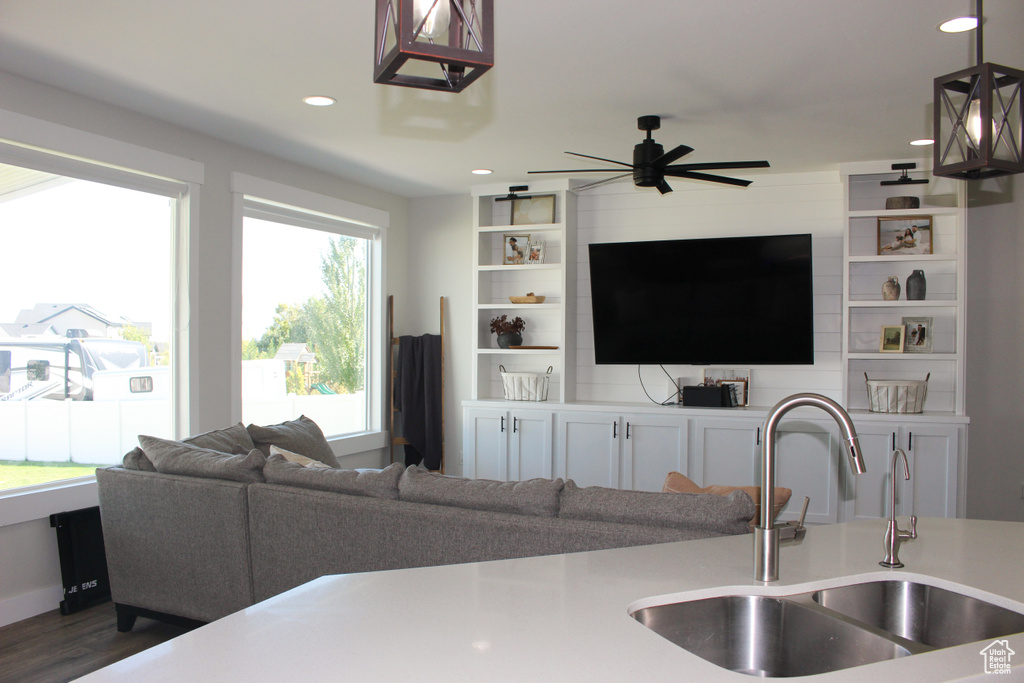Living area featuring dark wood finished floors, recessed lighting, and a ceiling fan