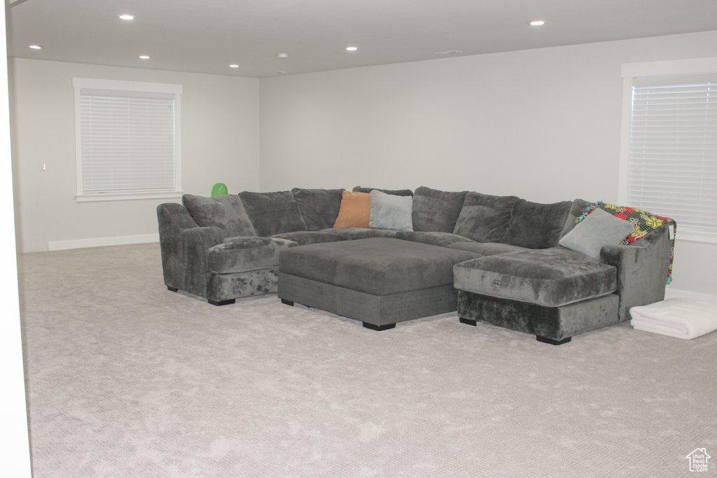 Living room featuring carpet flooring and recessed lighting