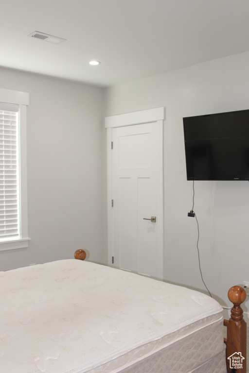 Bedroom with multiple windows