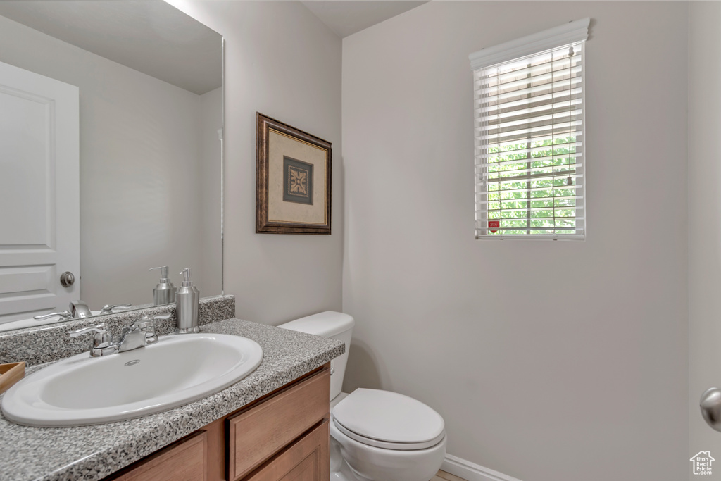 Bathroom featuring toilet and vanity